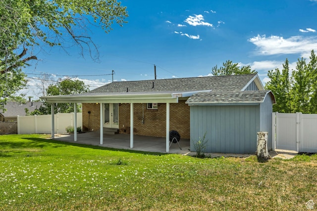 470 Hiland Rd, Ogden, UT 84404 - back of property featuring a fenced backyard, a shingled roof, a gate, a patio, and french doors