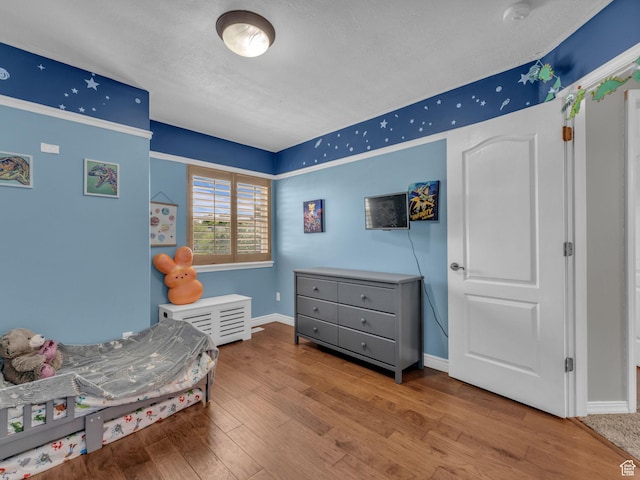 6238 W 8235 S, West Jordan, UT 84084 - bedroom with wood finished floors and a textured ceiling