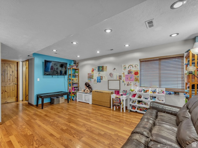 6238 W 8235 S, West Jordan, UT 84084 - living area featuring wood finished floors, recessed lighting, and a textured ceiling