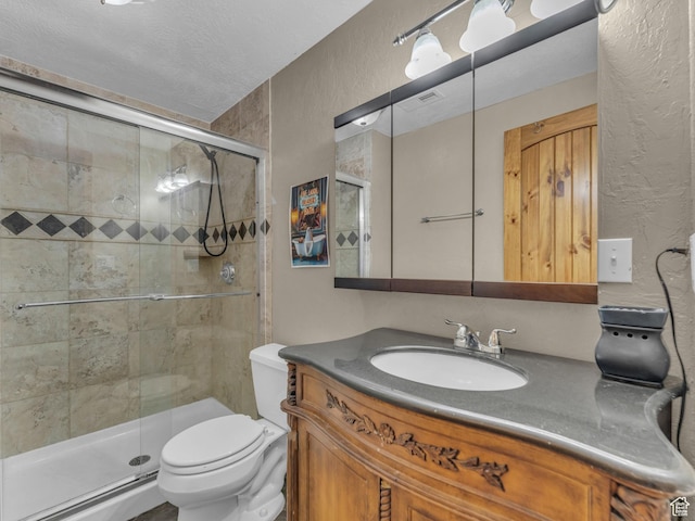 6238 W 8235 S, West Jordan, UT 84084 - bathroom with a textured wall, vanity, and a shower stall