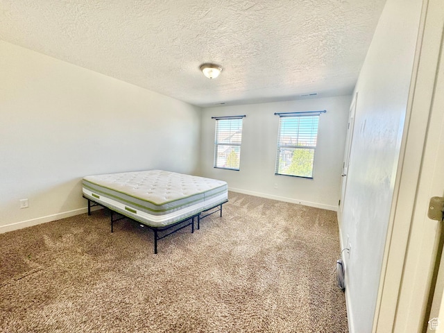 5923 W 8170 S Unit U102, West Jordan, UT 84081 - carpeted bedroom with a textured ceiling