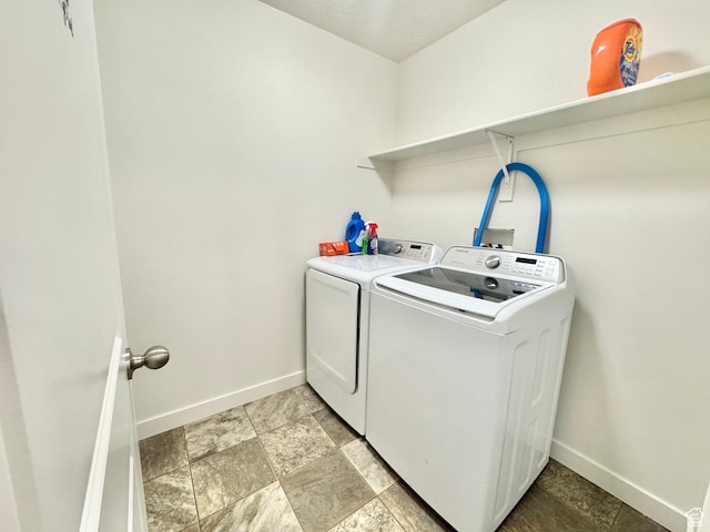 5923 W 8170 S Unit U102, West Jordan, UT 84081 - laundry area featuring washing machine and dryer and baseboards