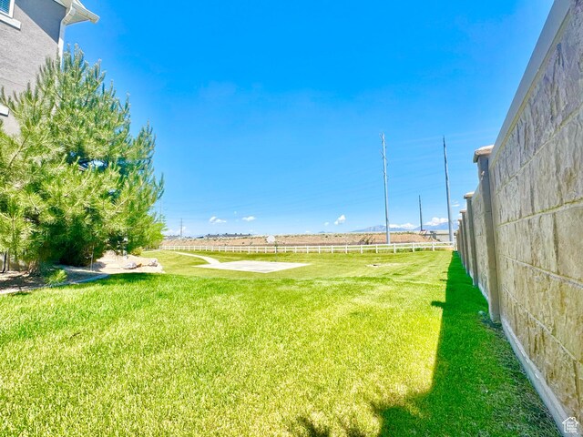 5923 W 8170 S Unit U102, West Jordan, UT 84081 - view of green lawn featuring a rural view