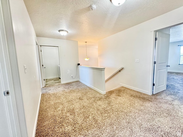 5923 W 8170 S Unit U102, West Jordan, UT 84081 - carpeted spare room featuring a textured ceiling and a smoke detector