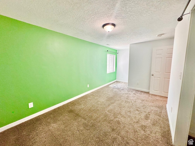 5923 W 8170 S Unit U102, West Jordan, UT 84081 - spare room with carpet floors and a textured ceiling