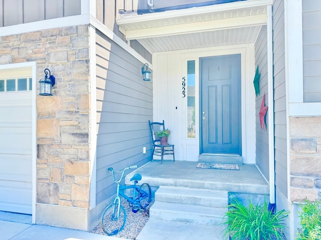 5923 W 8170 S Unit U102, West Jordan, UT 84081 - property entrance featuring stone siding