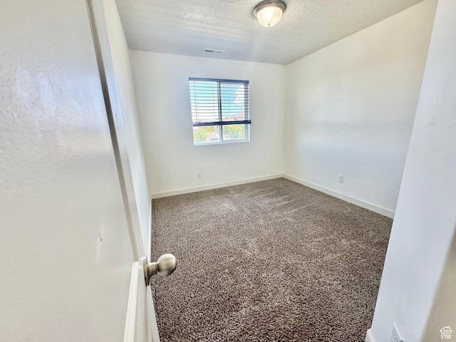5923 W 8170 S Unit U102, West Jordan, UT 84081 - unfurnished room featuring a textured ceiling and carpet floors