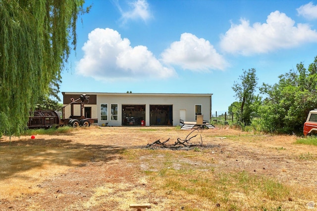 12800 N 1200 E, Cove, UT 84320 - rear view of property featuring an outdoor structure and a garage
