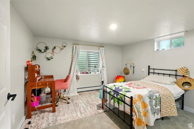 12800 N 1200 E, Cove, UT 84320 - carpeted bedroom featuring a baseboard heating unit and baseboards