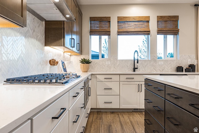 3539 E 1120 E Unit 110, Spanish Fork, UT 84660 - kitchen featuring wall chimney exhaust hood, wood finished floors, dark brown cabinets, white cabinetry, and recessed lighting