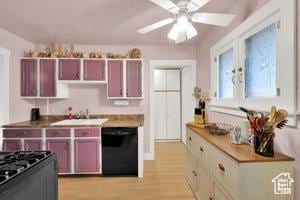 3022 S Jackson Ave E, Ogden, UT 84403 - kitchen with black dishwasher, ceiling fan, range, and light wood-style flooring