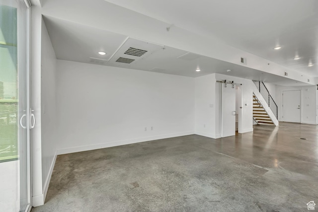 877 S 200 W Unit 212, Salt Lake City, UT 84101 - additional living space with finished concrete flooring, stairs, recessed lighting, and a barn door
