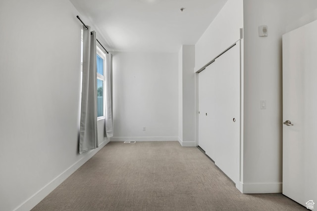 877 S 200 W Unit 212, Salt Lake City, UT 84101 - unfurnished bedroom featuring light colored carpet and a closet