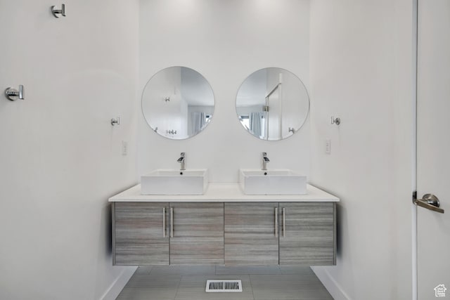 877 S 200 W Unit 212, Salt Lake City, UT 84101 - full bath featuring double vanity and tile patterned flooring