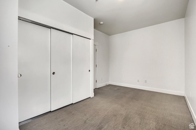 877 S 200 W Unit 212, Salt Lake City, UT 84101 - unfurnished bedroom featuring carpet and a closet
