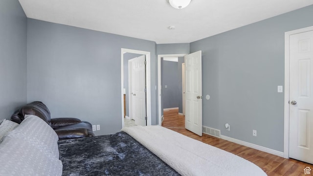 4111 S John Way W, West Valley City, UT 84120 - bedroom featuring wood finished floors and baseboards