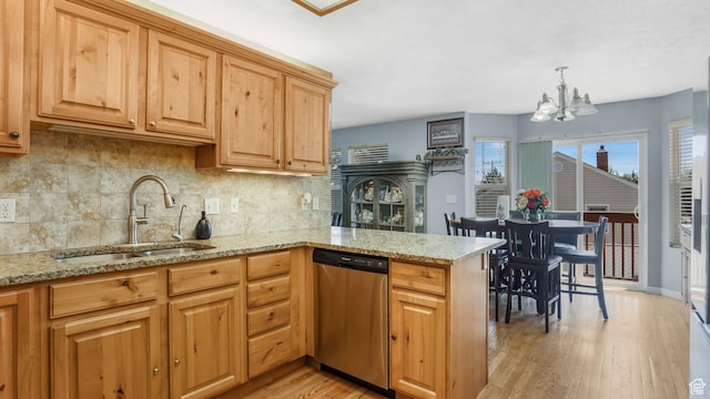 4111 S John Way W, West Valley City, UT 84120 - kitchen featuring dishwasher, a chandelier, tasteful backsplash, light wood-type flooring, and light stone countertops