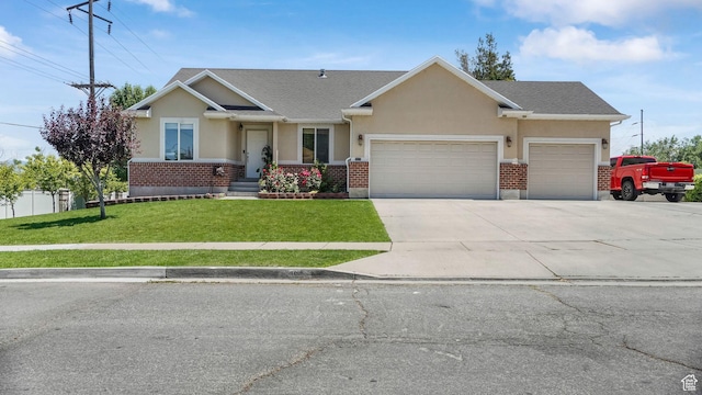 4111 S John Way W, West Valley City, UT 84120 - view of front of house featuring a garage, stucco siding, a front yard, and concrete driveway