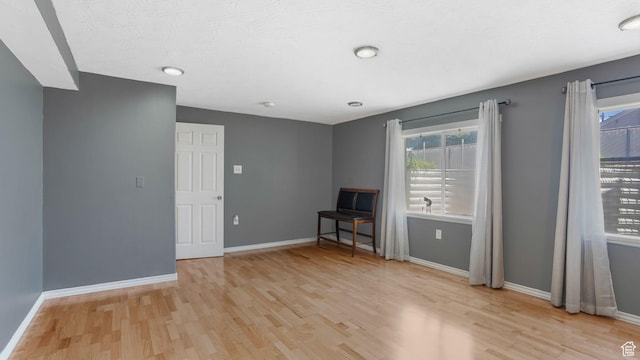 4111 S John Way W, West Valley City, UT 84120 - unfurnished room featuring light wood-type flooring and healthy amount of natural light