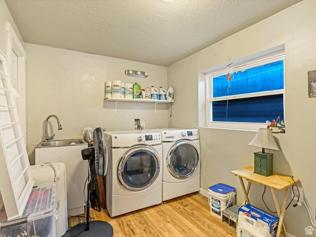9714 S Buttonwood Dr E, Sandy, UT 84092 - laundry area featuring independent washer and dryer, wood finished floors, and a textured ceiling