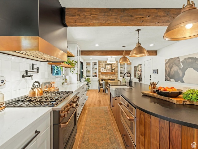 9714 S Buttonwood Dr E, Sandy, UT 84092 - kitchen with island range hood, high end range, light wood-style flooring, decorative backsplash, and beam ceiling