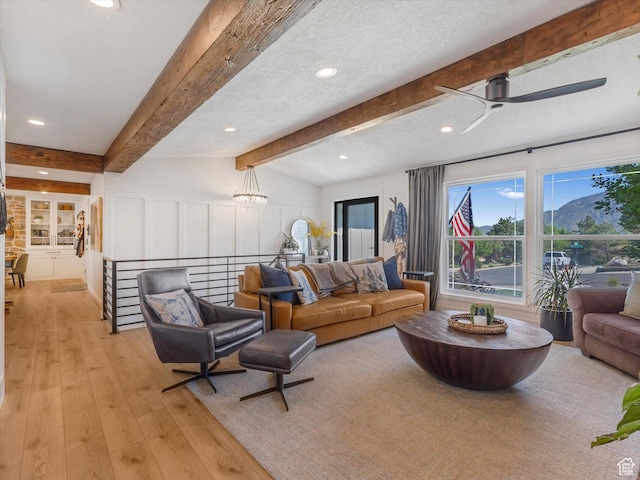 9714 S Buttonwood Dr E, Sandy, UT 84092 - living room with light wood-type flooring, recessed lighting, beam ceiling, and ceiling fan