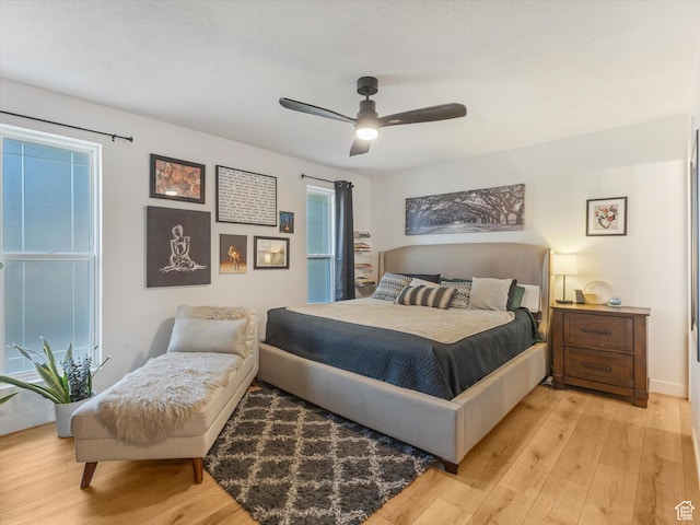 9714 S Buttonwood Dr E, Sandy, UT 84092 - bedroom with light wood-type flooring and a ceiling fan