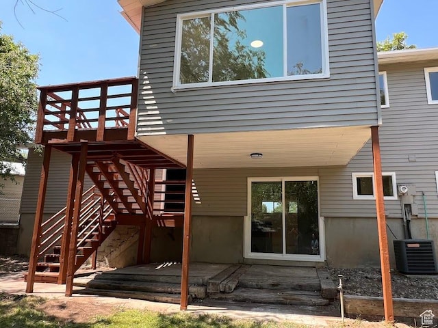 1569 E Boysenberry Cir S, Sandy, UT 84093 - back of property with a wooden deck and stairs