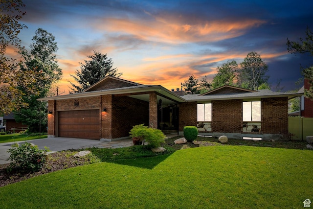 12012 S Hidden Valley Club Dr, Sandy, UT 84092 - view of front of property with a garage, concrete driveway, a yard, and brick siding