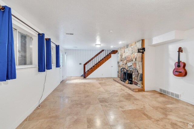 12012 S Hidden Valley Club Dr, Sandy, UT 84092 - unfurnished living room with a stone fireplace and stairway