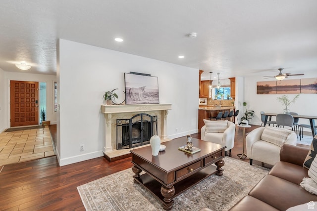12012 S Hidden Valley Club Dr, Sandy, UT 84092 - living area with ceiling fan, a premium fireplace, wood finished floors, and recessed lighting
