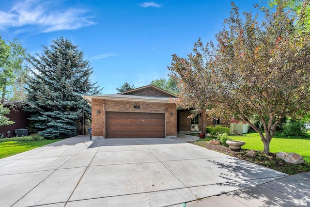 12012 S Hidden Valley Club Dr, Sandy, UT 84092 - view of front of home featuring a garage, driveway, a front lawn, and brick siding