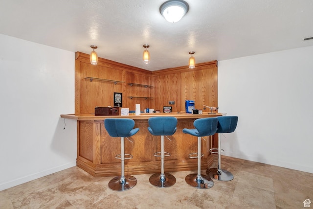 12012 S Hidden Valley Club Dr, Sandy, UT 84092 - indoor dry bar featuring baseboards and decorative light fixtures
