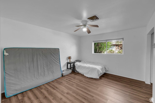 726 N Valley View Dr E, St George, UT 84770 - unfurnished bedroom with wood finished floors and ceiling fan