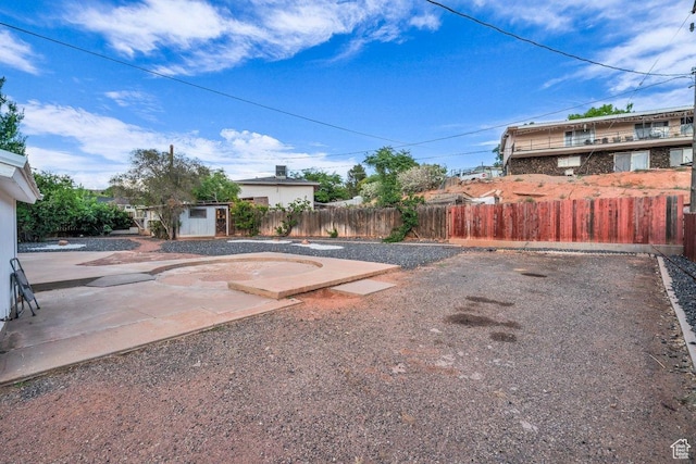 726 N Valley View Dr E, St George, UT 84770 - fenced backyard with a shed and a patio