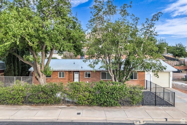 726 N Valley View Dr E, St George, UT 84770 - ranch-style house featuring a garage, concrete driveway, and brick siding