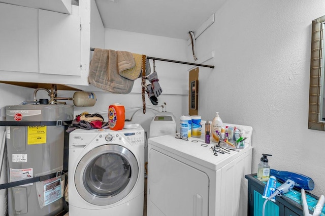 726 N Valley View Dr E, St George, UT 84770 - washroom featuring strapped water heater, separate washer and dryer, and cabinet space