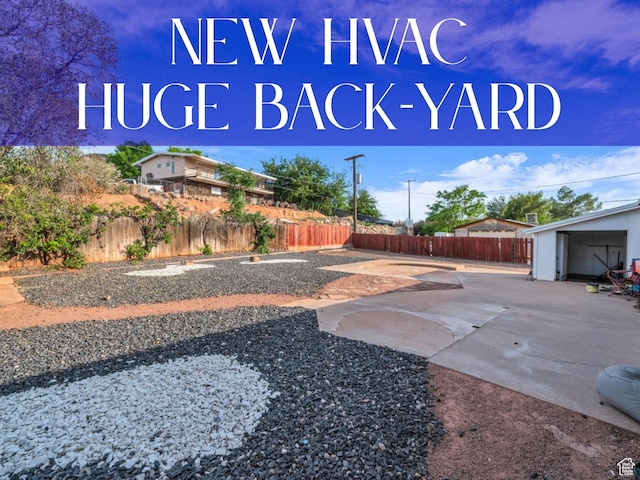726 N Valley View Dr E, St George, UT 84770 - fenced backyard featuring a patio area