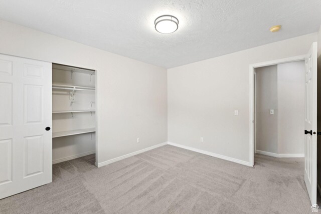 1212 Pinehurst Cir, Farmington, UT 84025 - unfurnished bedroom featuring carpet floors, a closet, and a textured ceiling
