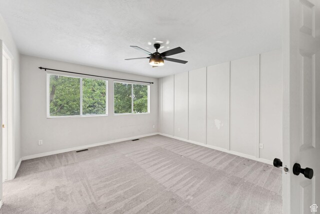 1212 Pinehurst Cir, Farmington, UT 84025 - spare room featuring carpet floors and a ceiling fan