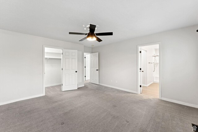 1212 Pinehurst Cir, Farmington, UT 84025 - unfurnished bedroom featuring carpet flooring, a walk in closet, a ceiling fan, ensuite bath, and a closet