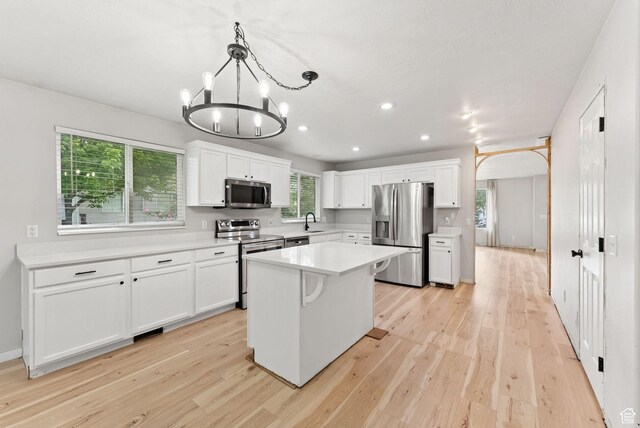 1212 Pinehurst Cir, Farmington, UT 84025 - kitchen featuring appliances with stainless steel finishes, light wood-style floors, white cabinetry, and recessed lighting