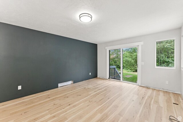 1212 Pinehurst Cir, Farmington, UT 84025 - spare room with wood finished floors and a textured ceiling