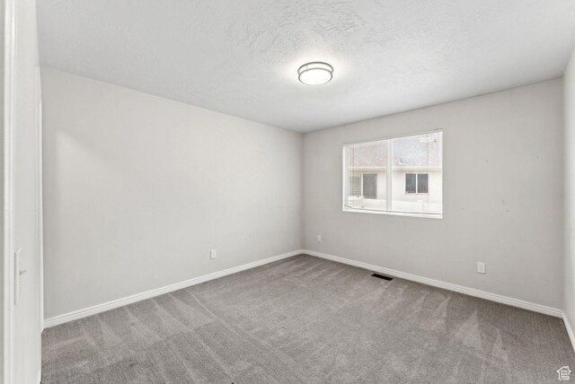 1212 Pinehurst Cir, Farmington, UT 84025 - carpeted spare room featuring baseboards and a textured ceiling