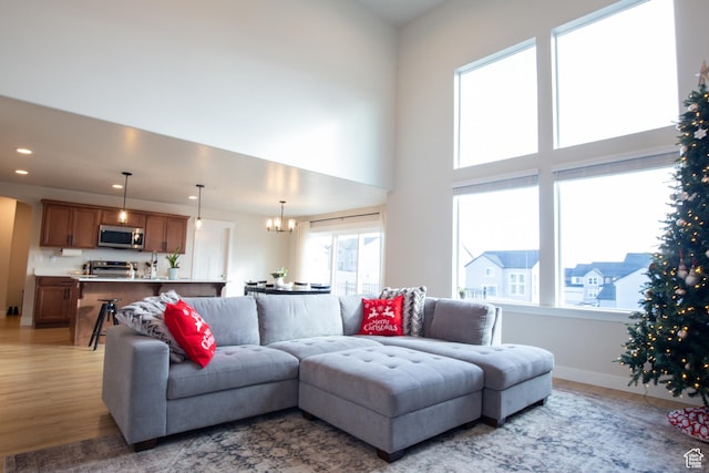 922 Olson Dr N, Saratoga Springs, UT 84045 - living area with light wood-style floors, a chandelier, and recessed lighting
