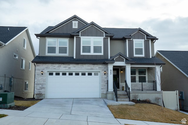922 Olson Dr N, Saratoga Springs, UT 84045 - craftsman inspired home featuring covered porch, board and batten siding, concrete driveway, and stone siding