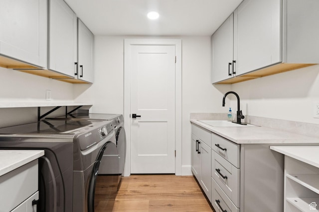 1537 N Sweetwater Ln, Farmington, UT 84025 - laundry room with cabinet space, washing machine and clothes dryer, light wood-style floors, and recessed lighting