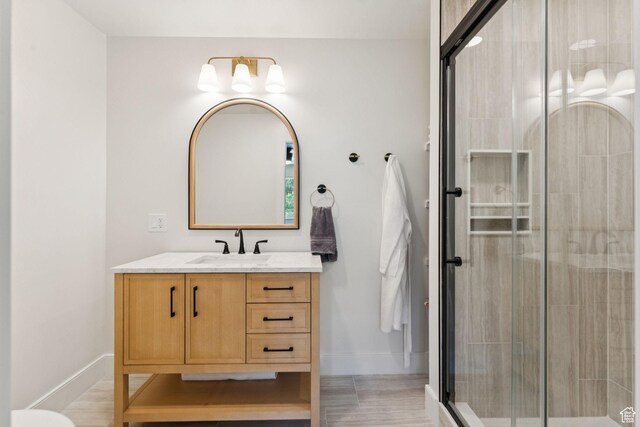 1537 N Sweetwater Ln, Farmington, UT 84025 - bathroom featuring vanity, a shower stall, and wood finished floors