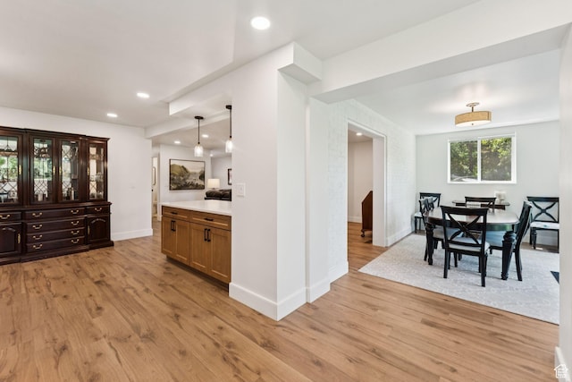 1537 N Sweetwater Ln, Farmington, UT 84025 - kitchen featuring light wood finished floors, light countertops, hanging light fixtures, and recessed lighting