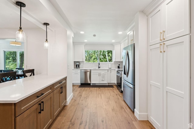 1537 N Sweetwater Ln, Farmington, UT 84025 - kitchen with stainless steel appliances, plenty of natural light, light wood-type flooring, decorative backsplash, and recessed lighting